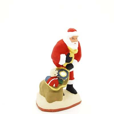 santon de provence peint à la main papa noel sac aux pieds profil