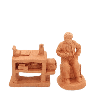 Ecrivain assis à son pupitre à peindre