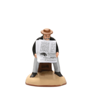 Homme assis au journal